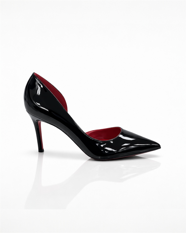 Black patent leather high-heeled shoe with a red sole.