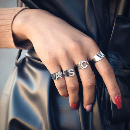 Delicate ring with initial and cubic zirconia.