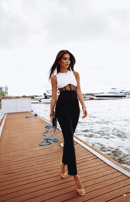 Two-tone black and white jumpsuit with sheer details.