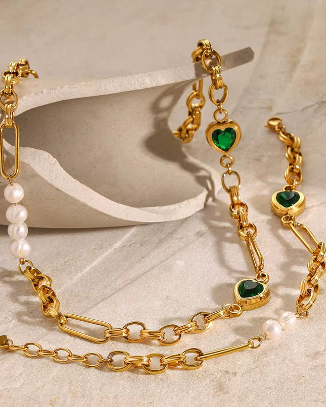 Stainless steel necklace with green hearts.