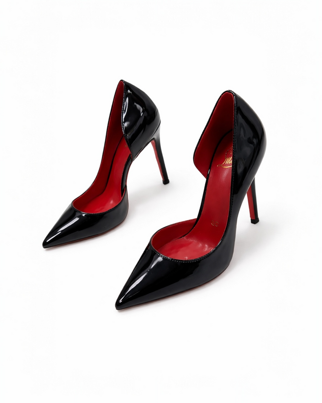 Black patent leather high-heeled shoe with a red sole.