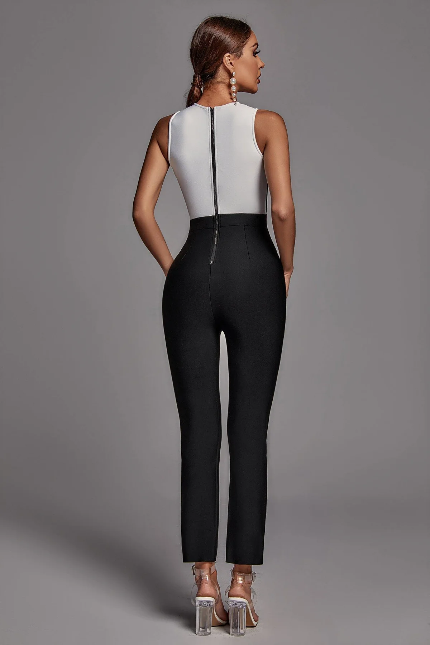 Two-tone black and white jumpsuit with sheer details.