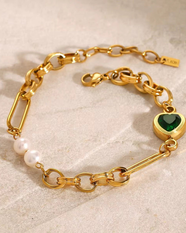 Stainless steel necklace with green hearts.
